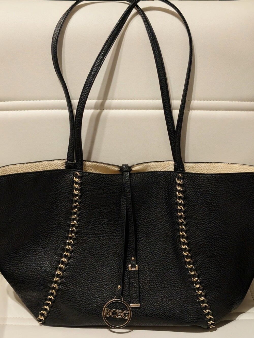 BCBG Large Black Tote with Gold Chain Trim and Logo Charm Duffle Bag..